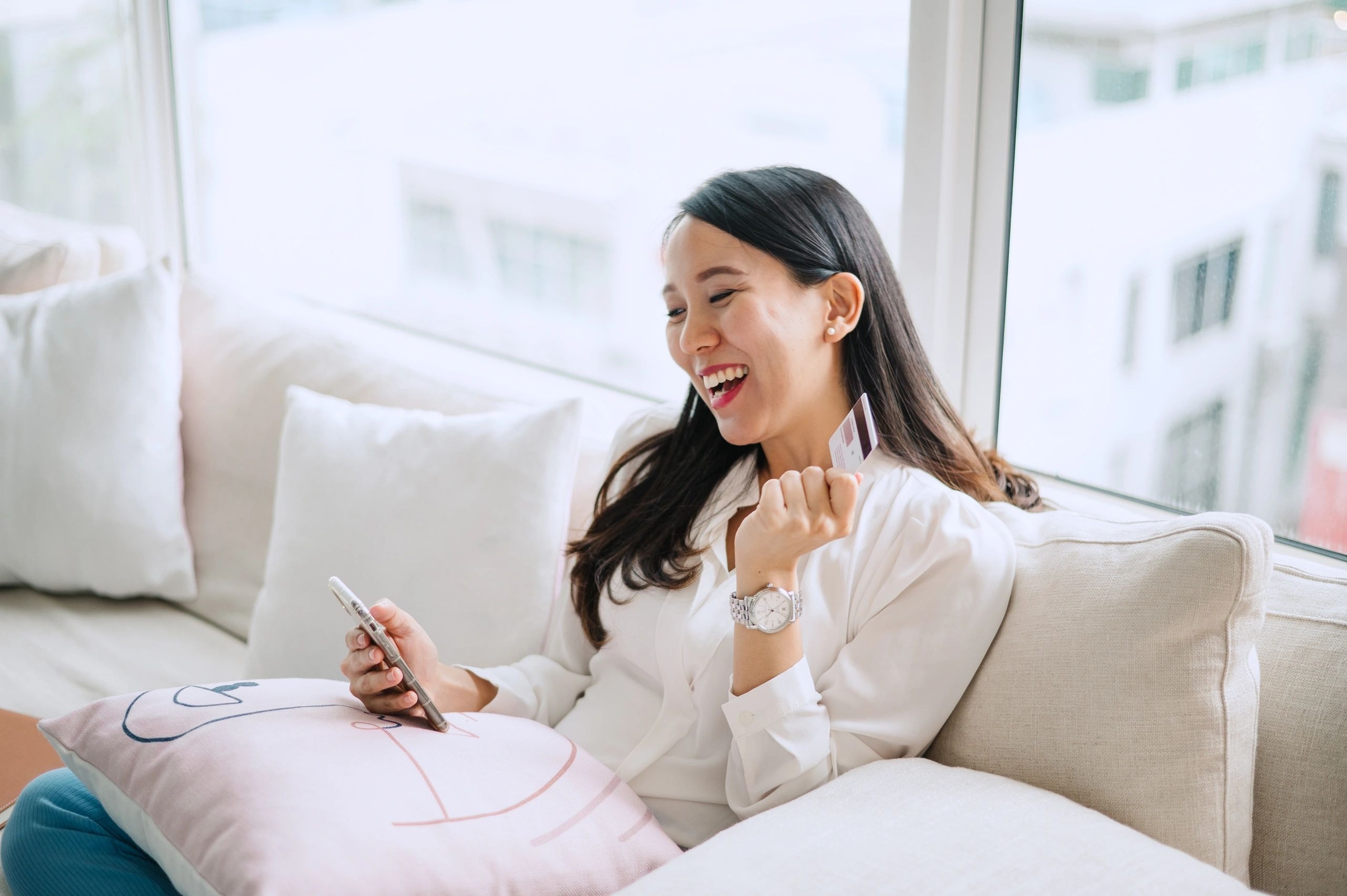 Business owner using a phone and credit card